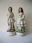 Pair of Staffordshire Figures of Girl and Boy with Toys