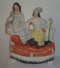 Staffordshire Group Figure of a Couple on Couch with Bird