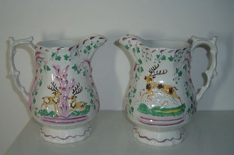 Pair of Early Victorian Staffordshire Relief Purple Lustre Jugs