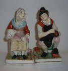 A Pair of Staffordshire Figures Cobbler and his Wife