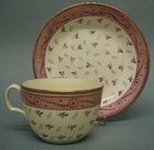 A Staffordshire Lustre Decorated Tea Cup and Saucer