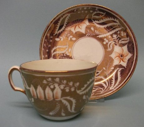 A Lustre Decorated Bute Shape Cup and Saucer