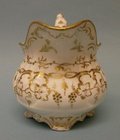 A Moulded and Gilt Cream Jug