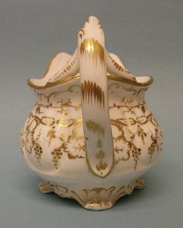 A Moulded and Gilt Cream Jug