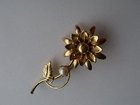 Gold tone and faux pearl flower brooch