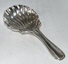 Silver Caddy Spoon. Maker H.F with a diamond shape-Unidentified.