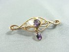 15CT GOLD AND AMETHYST BROOCH