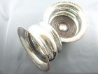 A PAIR OF SILVER PLATED COASTERS