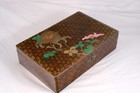 A 20th century Japanese lacquered and floral decorated rectangular lidded box