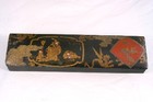 A 19th century Chinese lacquered and gilt decorated pen box