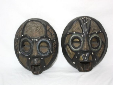 A pair of early 20th Century West African Carved Wood Tribal Masks