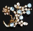 Pretty vintage blue and clear diamonte floral brooch