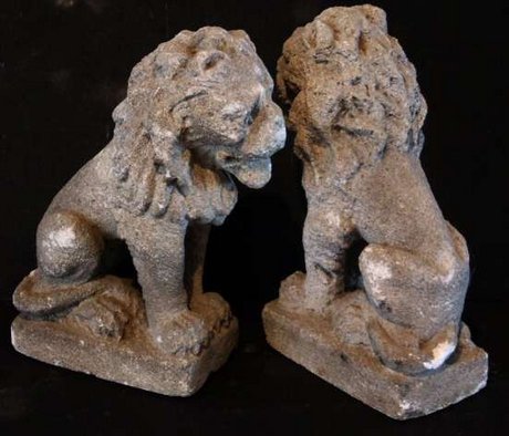 Pair of decorative carved stone style lions of small proportions
