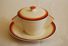 A Clarice Cliff soup cup, saucer and lid
