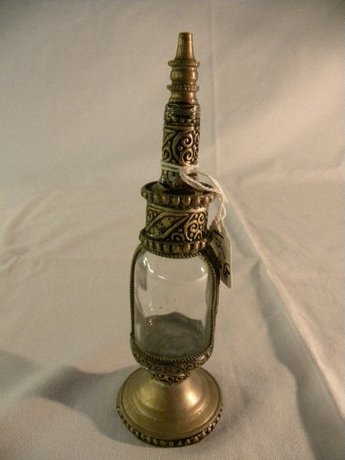 Metal and glass perfume bottle