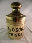 A French brass mounted glass whisky bottle 