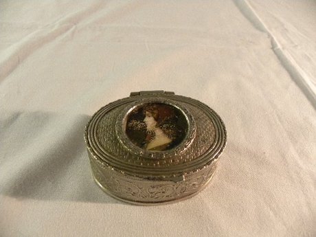 Oval metal trinket box