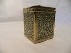 A highly embossed brass tea caddy