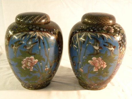 A pair of oriental cloisonne ginger jars