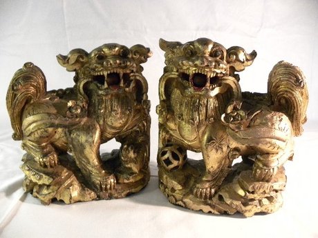 Pair of carved gilt wood Chinese Chi Chi dogs