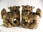 Pair of carved gilt wood Chinese Chi Chi dogs