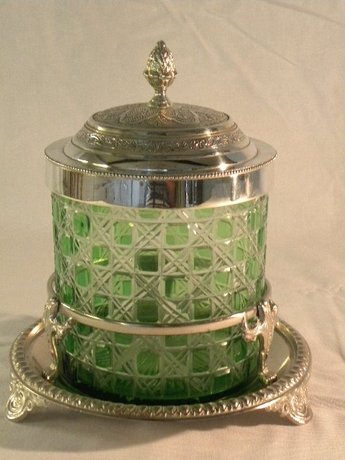 A green cut glass metal mounted biscuit barrel