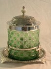 A green cut glass metal mounted biscuit barrel