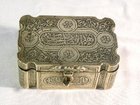 An engraved brass box of middle eastern origin