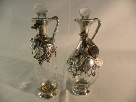 Pair of glass and continental silver mounted oil & vinegar bottle