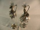Pair of glass and continental silver mounted oil & vinegar bottle