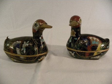 A pair of cloisonne boxes in the shape of ducks