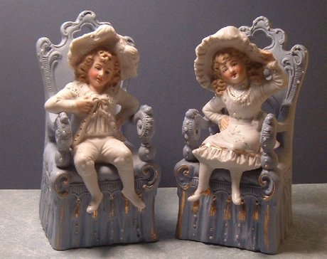 Pair of German Bisque Seated Child Figures