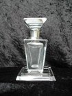 A SILVER TOPPED THREE PIECE GLASS PERFUME BOTTLE